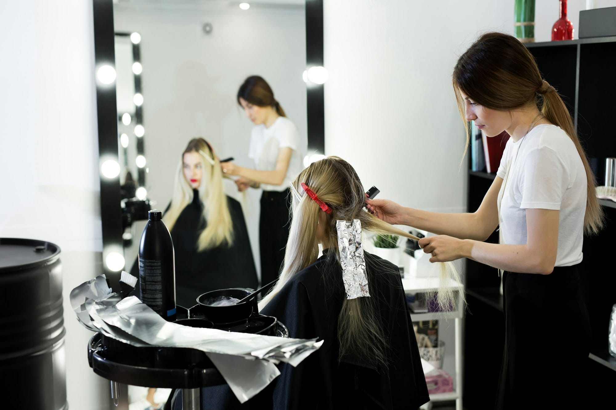 Process of dyeing hair at beauty salon.